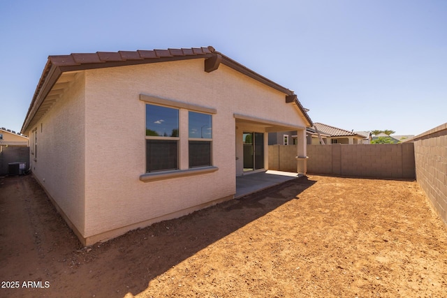 15788 W Georgia Dr W, Surprise, AZ 85379 - rear view of house featuring a fenced backyard, central AC unit, stucco siding, and a patio area
