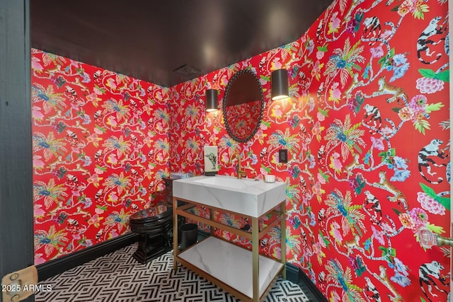 8219 S Pecan Grove Cir, Tempe, AZ 85284 - bathroom with wallpapered walls, baseboards, and vanity