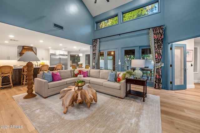 8219 S Pecan Grove Cir, Tempe, AZ 85284 - living room featuring high vaulted ceiling, light wood-style flooring, plenty of natural light, and recessed lighting