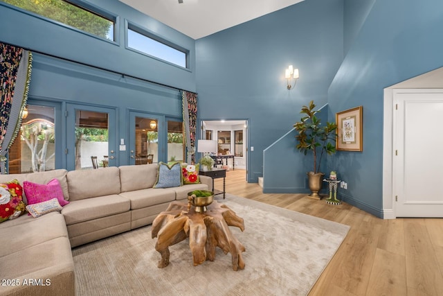 8219 S Pecan Grove Cir, Tempe, AZ 85284 - living room with a high ceiling, wood finished floors, and baseboards