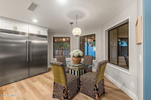 8219 S Pecan Grove Cir, Tempe, AZ 85284 - dining space with light wood-style floors and baseboards