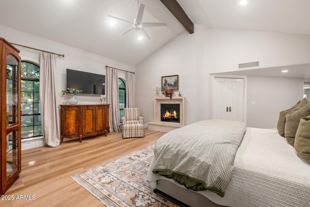 8219 S Pecan Grove Cir, Tempe, AZ 85284 - bedroom featuring beamed ceiling, light wood-type flooring, a warm lit fireplace, high vaulted ceiling, and recessed lighting