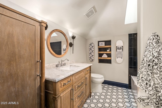 8219 S Pecan Grove Cir, Tempe, AZ 85284 - bathroom featuring vanity, toilet, shower / bathtub combination, and baseboards