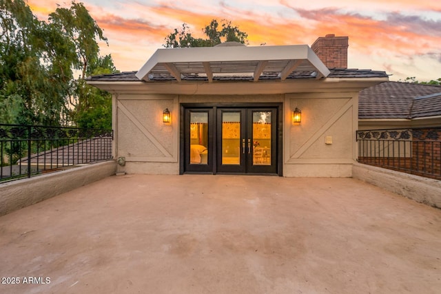 8219 S Pecan Grove Cir, Tempe, AZ 85284 - rear view of house featuring a patio area, stucco siding, and a chimney
