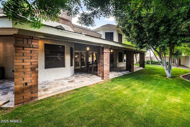 8219 S Pecan Grove Cir, Tempe, AZ 85284 - back of house with a patio area, stucco siding, and brick siding