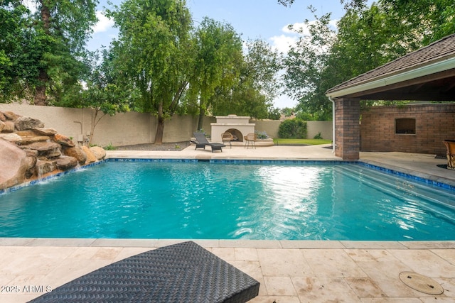 8219 S Pecan Grove Cir, Tempe, AZ 85284 - view of pool featuring a fireplace, a patio area, and a fenced backyard