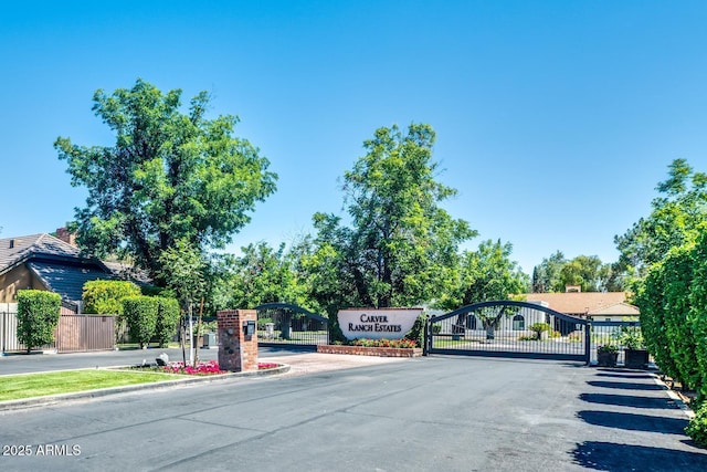 8219 S Pecan Grove Cir, Tempe, AZ 85284 - view of asphalt street with a gated entry, curbs, and a gate