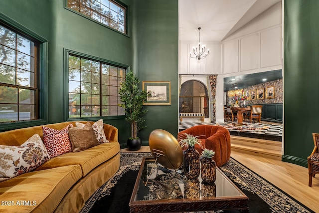 8219 S Pecan Grove Cir, Tempe, AZ 85284 - living area with a chandelier, wood finished floors, and high vaulted ceiling