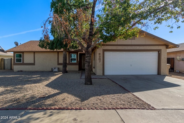 ranch-style house featuring a garage