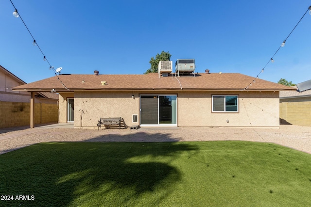 back of house featuring a patio, fence, a lawn, and stucco siding