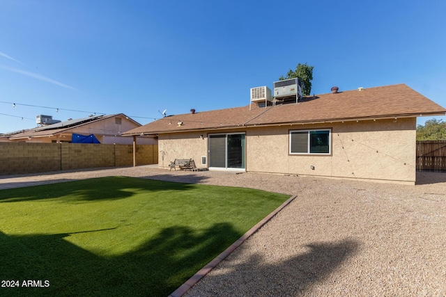 back of house featuring central air condition unit, a patio area, a fenced backyard, and stucco siding