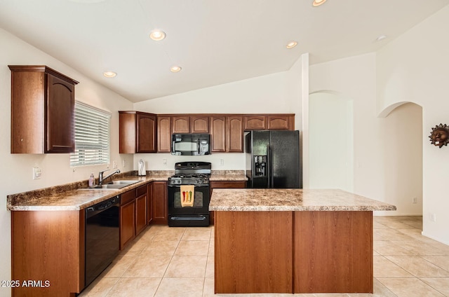 5502 N Ormondo Way, Litchfield Park, AZ 85340 - kitchen featuring black appliances, a sink, light tile patterned floors, a center island, and lofted ceiling
