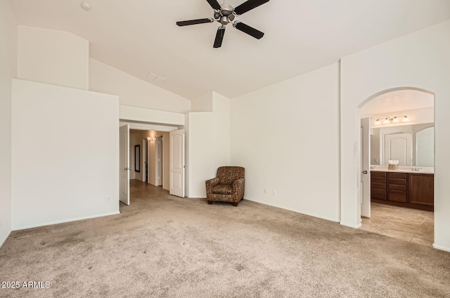 5502 N Ormondo Way, Litchfield Park, AZ 85340 - unfurnished room featuring light carpet, ceiling fan, arched walkways, and high vaulted ceiling