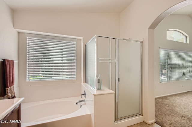 5502 N Ormondo Way, Litchfield Park, AZ 85340 - bathroom featuring a bath, a shower stall, plenty of natural light, and vanity