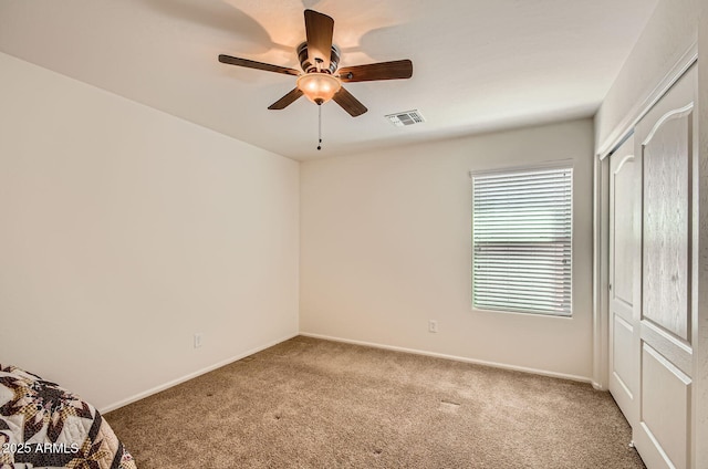 5502 N Ormondo Way, Litchfield Park, AZ 85340 - unfurnished bedroom with carpet, baseboards, and a ceiling fan