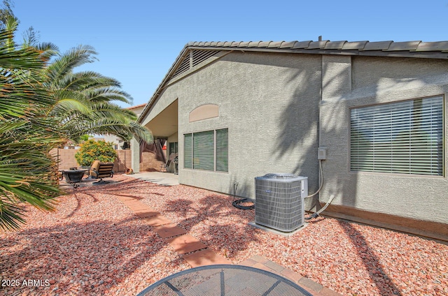 5502 N Ormondo Way, Litchfield Park, AZ 85340 - back of house featuring central AC, stucco siding, and a patio area