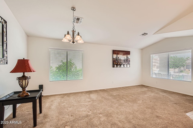 5502 N Ormondo Way, Litchfield Park, AZ 85340 - carpeted empty room with a chandelier, vaulted ceiling, and baseboards