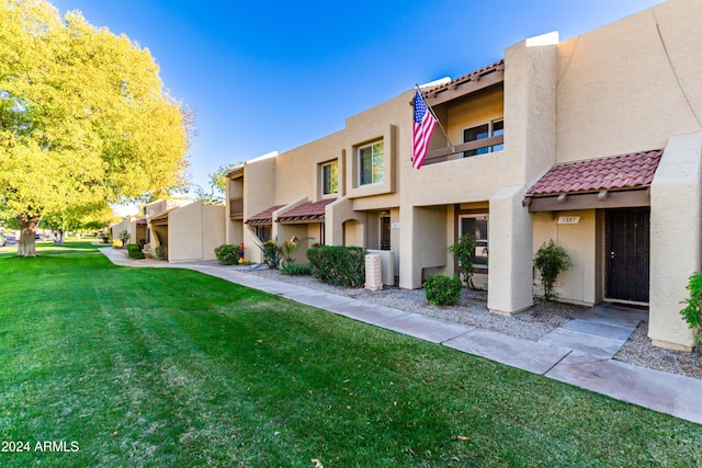 exterior space with a front lawn