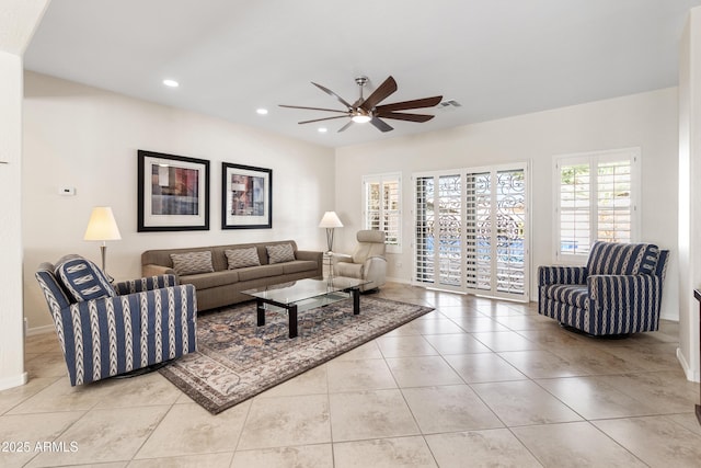 living room with recessed lighting, visible vents, ceiling fan, tile patterned flooring, and baseboards