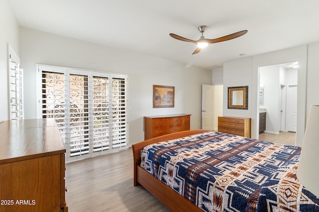 bedroom with light wood finished floors and a ceiling fan