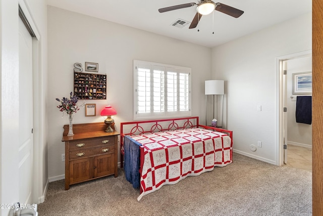 bedroom with ceiling fan, carpet floors, visible vents, baseboards, and a closet