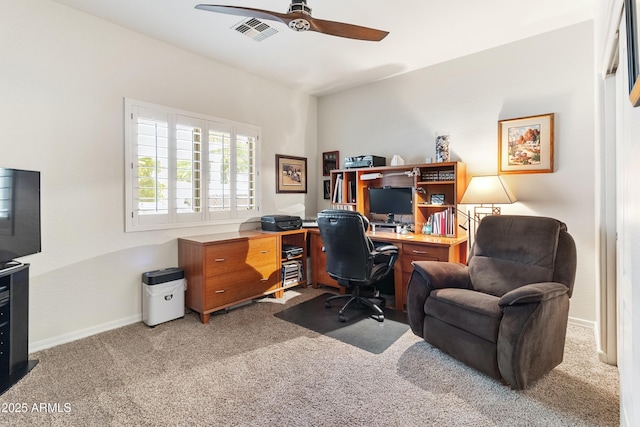 carpeted office with visible vents, ceiling fan, and baseboards