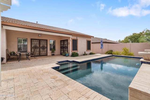 view of pool with fence, a fenced in pool, and a patio