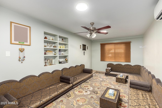 living room with an AC wall unit, ceiling fan, and built in features