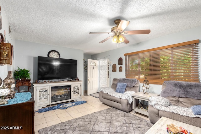 tiled living room with ceiling fan and a textured ceiling