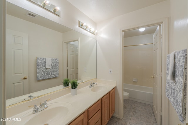 full bathroom featuring tile patterned floors, toilet, bathing tub / shower combination, and vanity