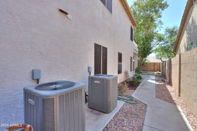 view of side of home featuring central AC unit