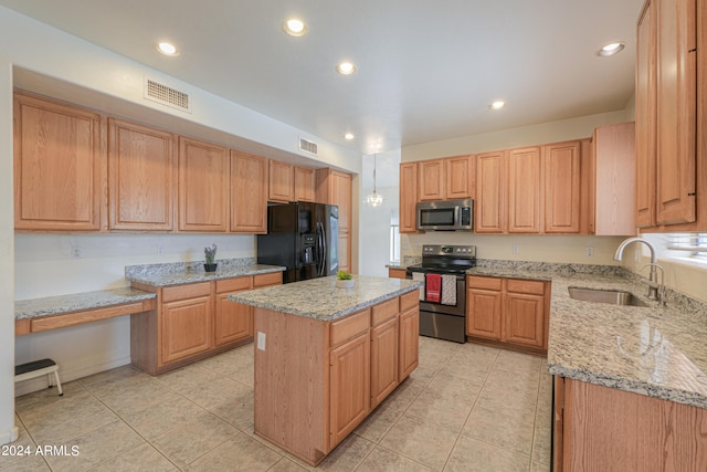 kitchen with black appliances, a kitchen island, light stone counters, and sink