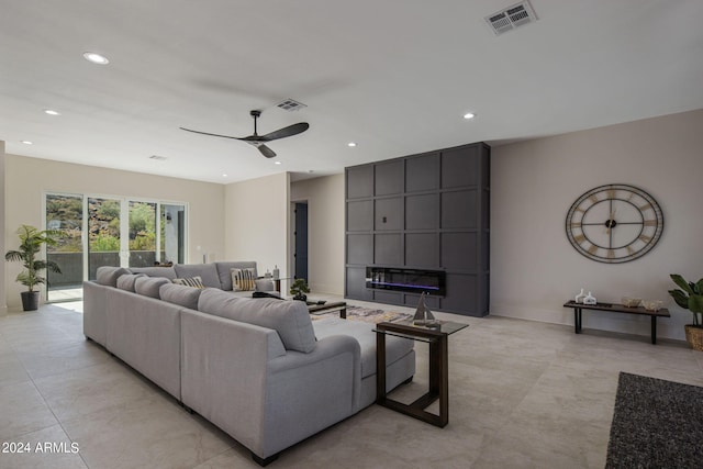 living room with ceiling fan, a fireplace, visible vents, and recessed lighting