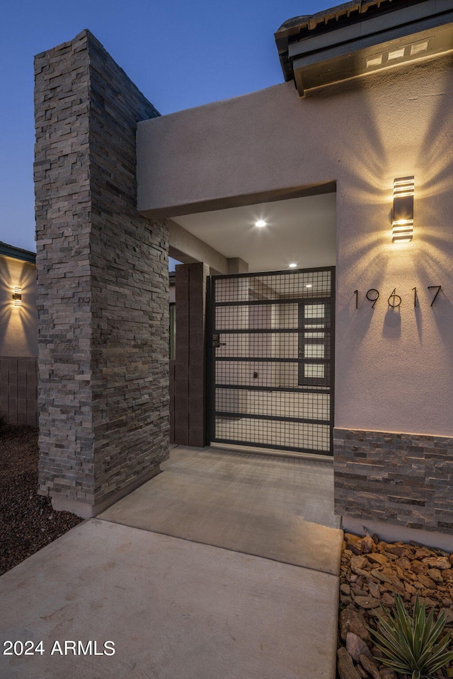 view of gate at dusk