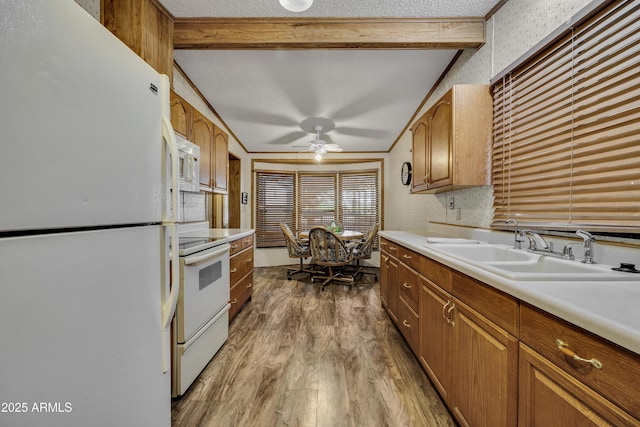 17124 E Fairway Dr, Mayer, AZ 86333 - kitchen with white appliances, wood finished floors, beamed ceiling, light countertops, and a ceiling fan