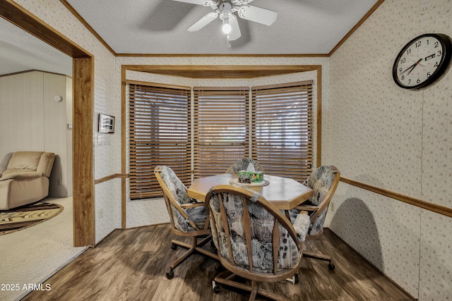 17124 E Fairway Dr, Mayer, AZ 86333 - dining area with crown molding, wallpapered walls, wood finished floors, a textured ceiling, and ceiling fan
