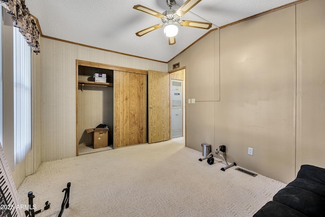 17124 E Fairway Dr, Mayer, AZ 86333 - carpeted bedroom with crown molding, a closet, ceiling fan, lofted ceiling, and a textured ceiling