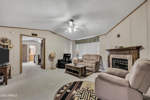 17124 E Fairway Dr, Mayer, AZ 86333 - carpeted living area with vaulted ceiling, a ceiling fan, a brick fireplace, a textured ceiling, and ornamental molding