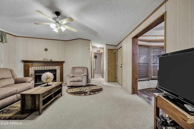 17124 E Fairway Dr, Mayer, AZ 86333 - living area featuring ornamental molding, ceiling fan, carpet floors, a brick fireplace, and a textured ceiling