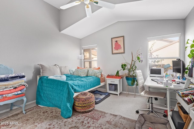 carpeted bedroom with a ceiling fan, baseboards, and lofted ceiling