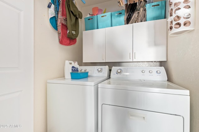 clothes washing area with cabinet space and washer and dryer