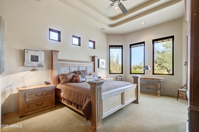 bedroom with ceiling fan and light colored carpet