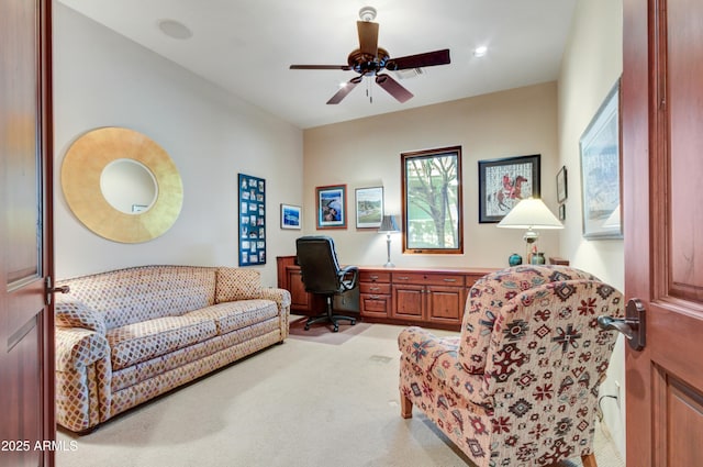 interior space with ceiling fan