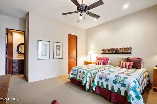 carpeted bedroom featuring ceiling fan and connected bathroom