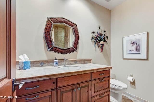 bathroom with tile patterned floors, toilet, and vanity