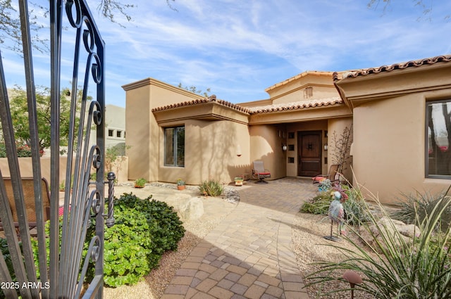 doorway to property with a patio area