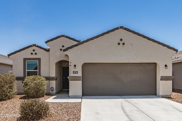 4713 W Nutmeg Ave, Coolidge, AZ 85128 - mediterranean / spanish-style house with stucco siding, a garage, driveway, and a tiled roof