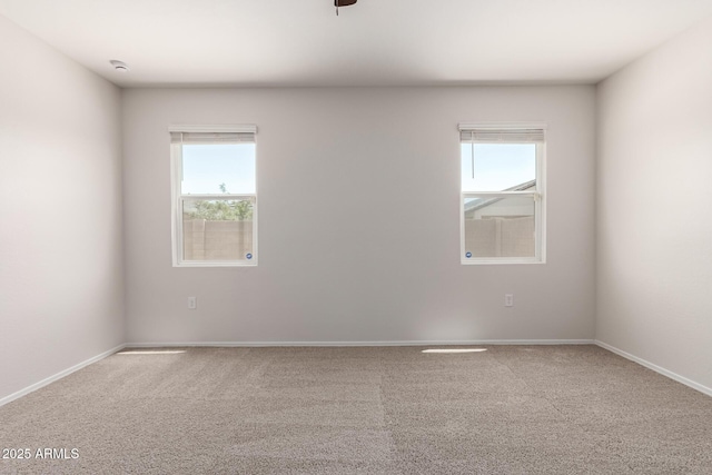 4713 W Nutmeg Ave, Coolidge, AZ 85128 - carpeted empty room featuring a smoke detector and ceiling fan