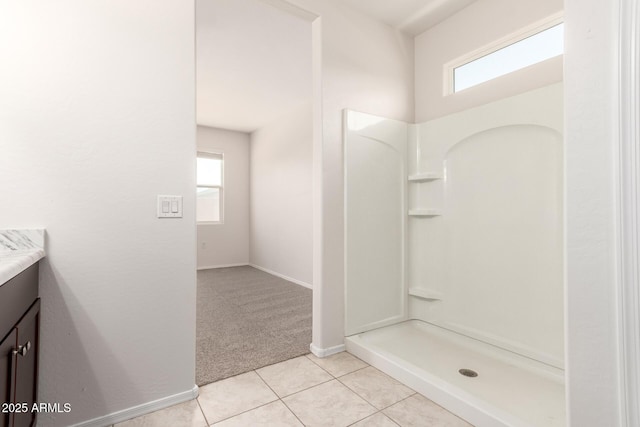 4713 W Nutmeg Ave, Coolidge, AZ 85128 - bathroom with vanity, plenty of natural light, a shower, and tile patterned flooring
