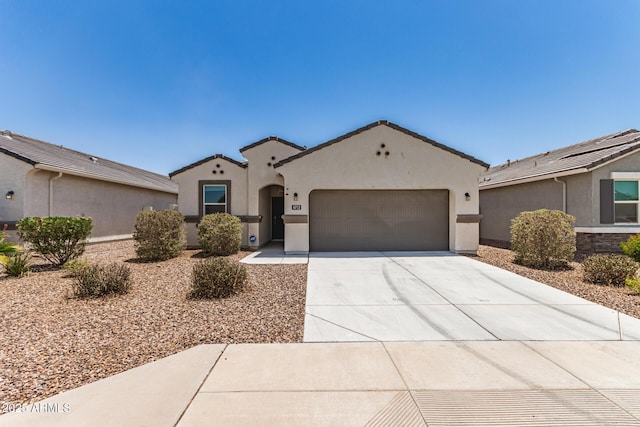 4713 W Nutmeg Ave, Coolidge, AZ 85128 - mediterranean / spanish-style home with a garage, stucco siding, and driveway
